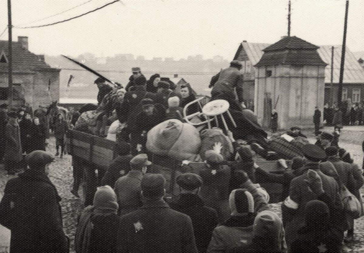 Jews being loaded onto trucks with their luggage during a deportation from the Kovno Ghetto, Lithuania, October 1943
