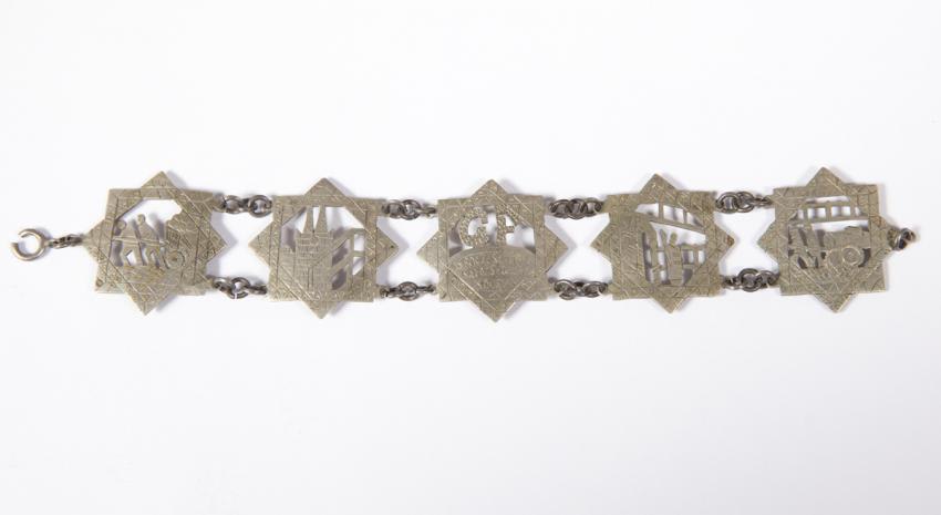Bracelet found in the liquidated Lodz ghetto, engraved with depictions of life in the ghetto and the date 30 September 1943