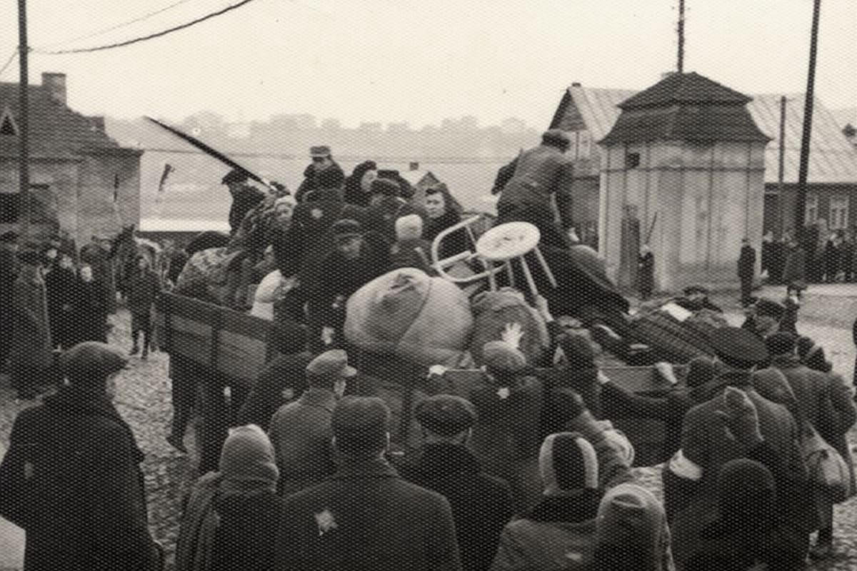 Jews being loaded onto trucks with their luggage during a deportation from the Kovno Ghetto, Lithuania, October 1943
