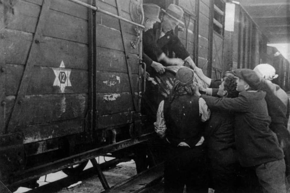Jews boarding a deportation train during the deportation of Macedonian Jews, Mach 1943
