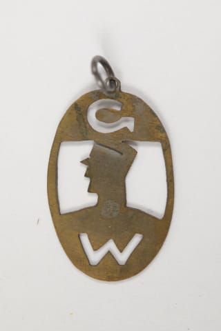 Insignia of the Ghetto Watch members in Theresienstadt, bearing the letters G and W, the abbreviated form of Ghetto Wache.