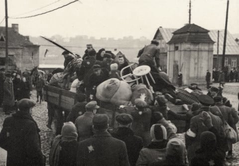 Jews being loaded onto trucks with their luggage during a deportation from the Kovno Ghetto, Lithuania, October 1943