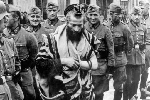 German policemen humiliating Rabbi Moshe Yitzhak Hagermann on "Bloody Wednesday" in Olkusz, Poland, 31/07/1940
