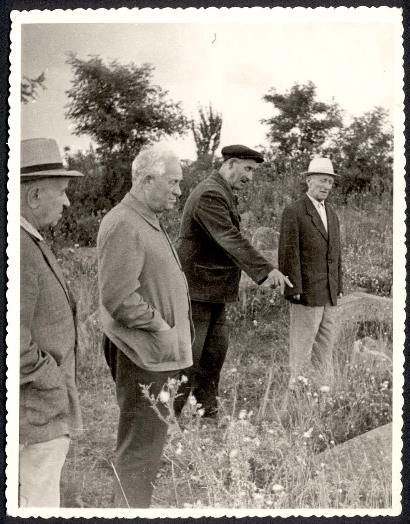 Holocaust survivors at the murder site near Basalychevka village