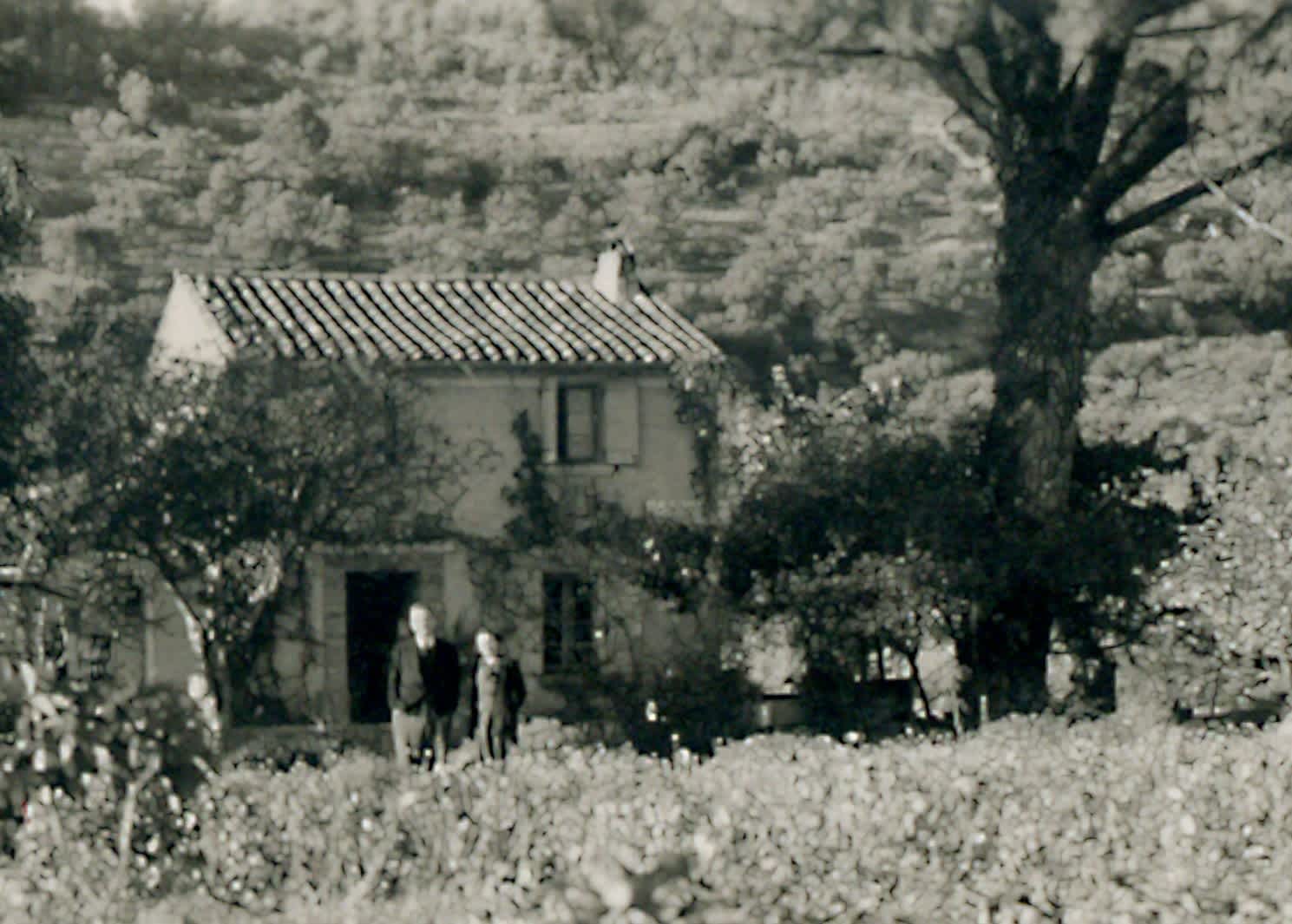 Walda and Eugene Vies in front of their farmhouse