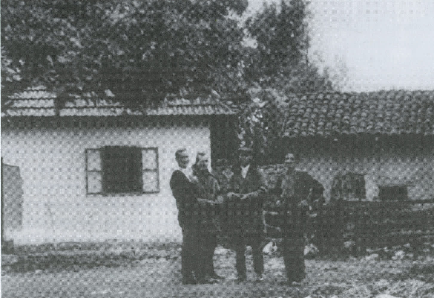 Alexander Djurkovic, first on the right. In the background the farm where the Levi family hid