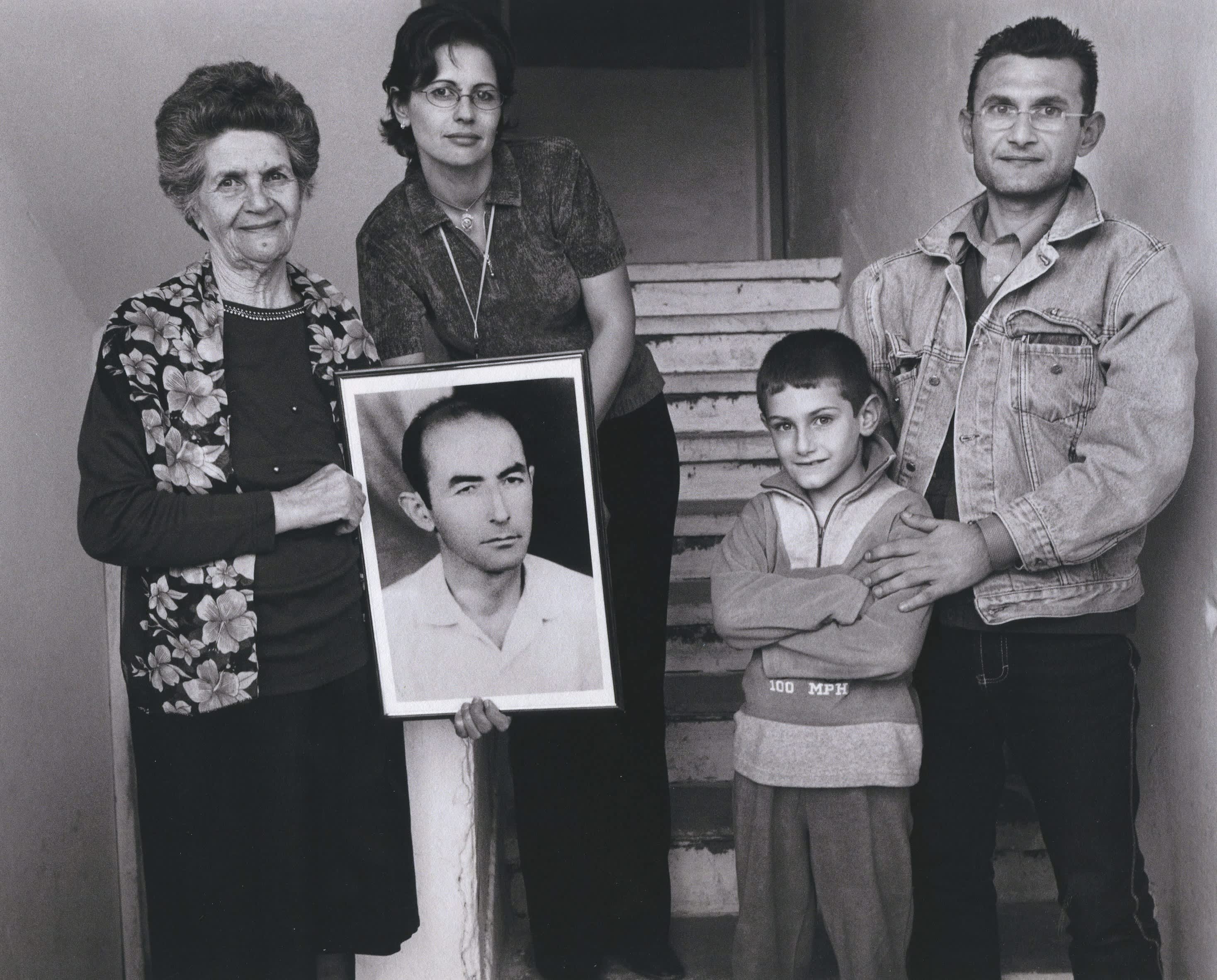 The Lekatari family holding a photo of Mihal Lekatari. Photogrphed by Norman Gershman.