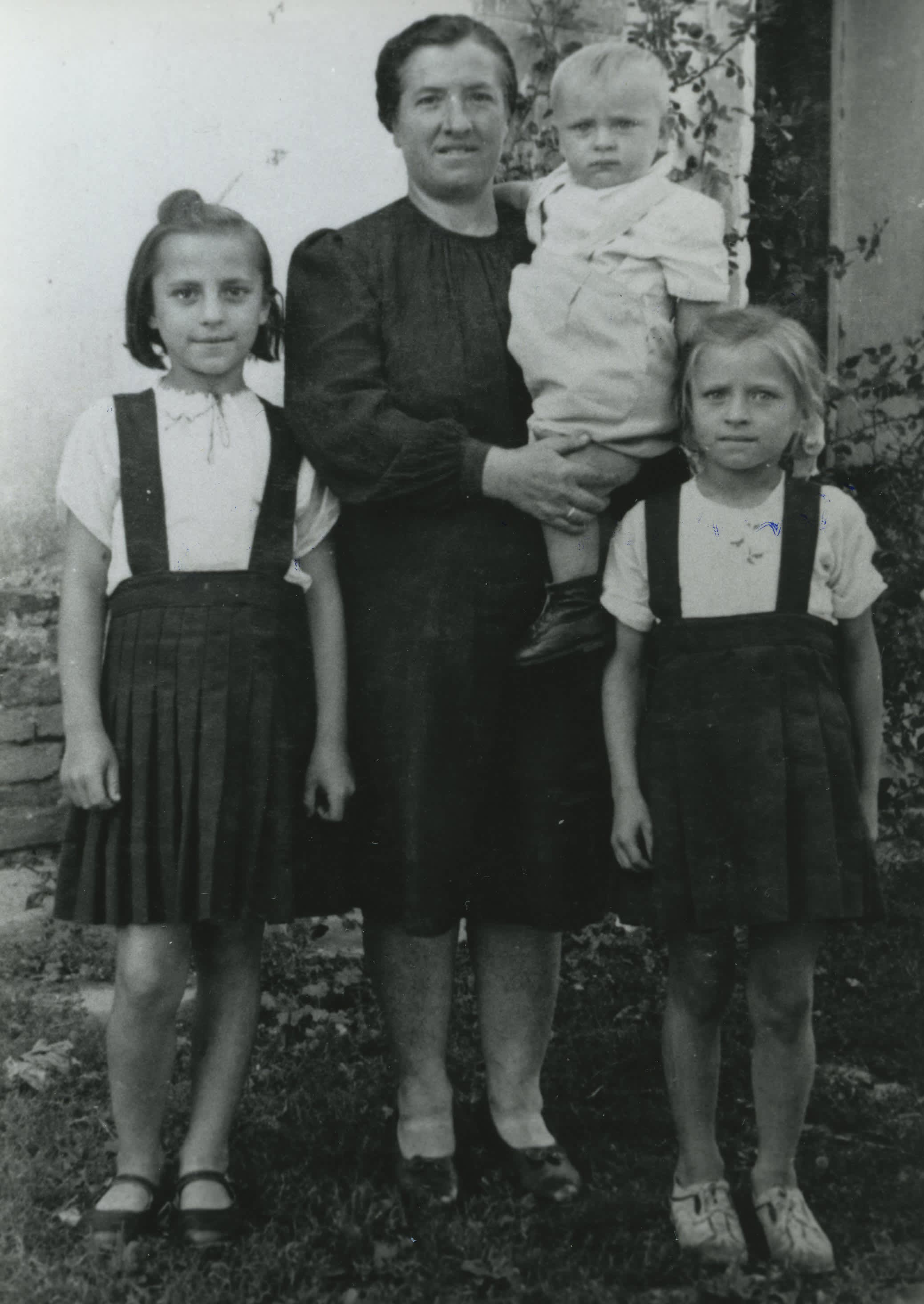 Ms. Rajski Stasha, Irka and their brother after the war, 1949