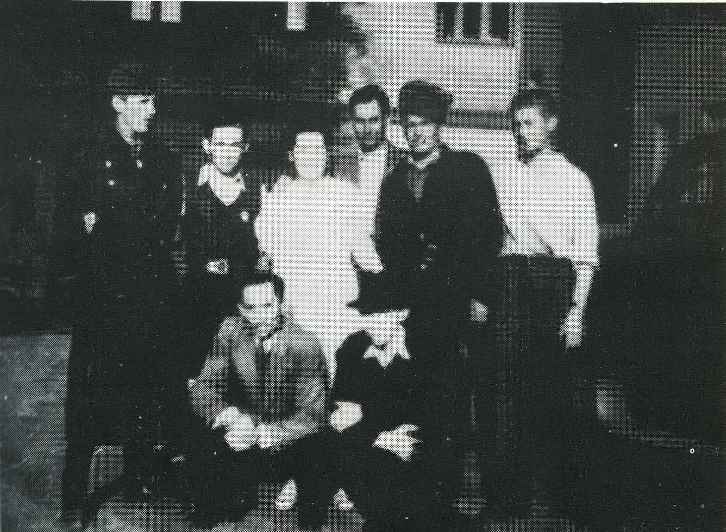 Rescuer and rescued after the war in front of the building where they were hidden. Standing from right to left: Abraham Harshalom, a Soviet soldier, Bolek Guy, Jirina Sobotkova, David Moskowitz, Soviet soldier  David Moshkovitz, and David Bolek.  