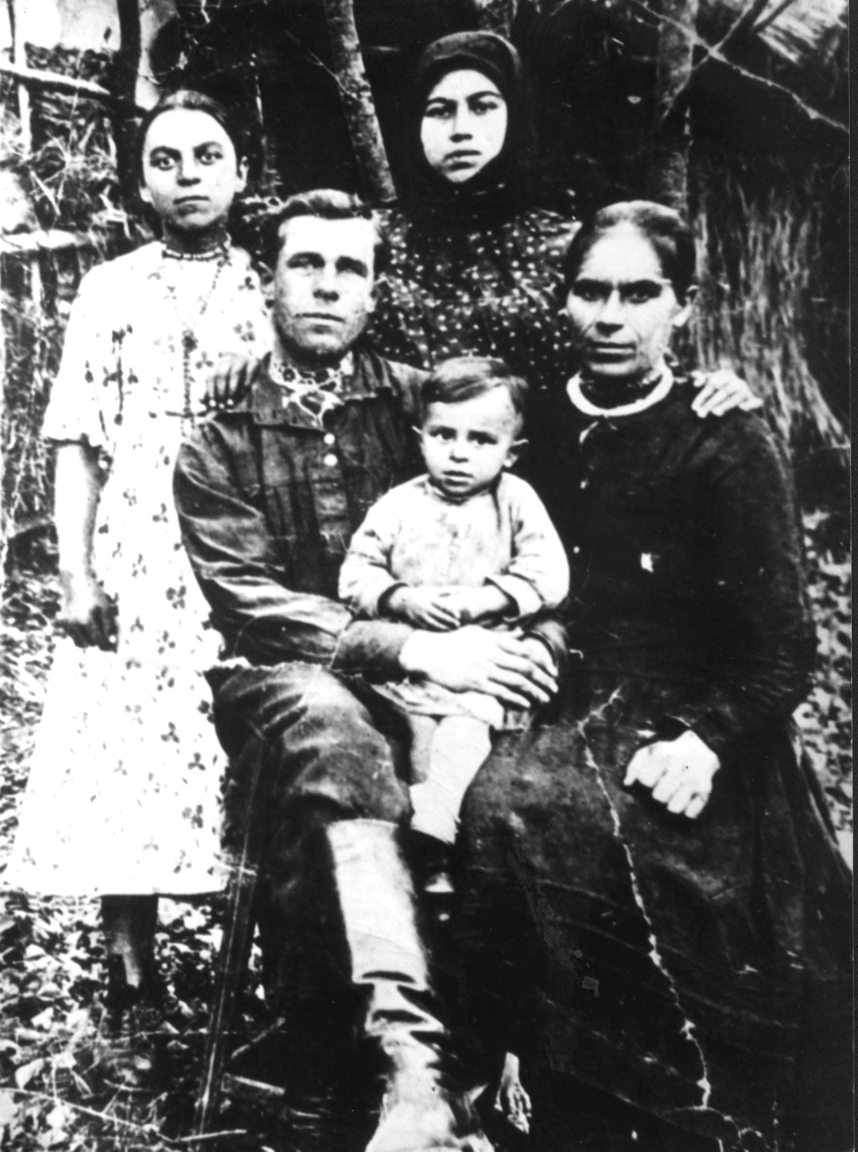 Rescuers Pavlo and Tatiana Movchan  (sitting) and survivor Ruzya  Tzodikova (standing on the right). 1943