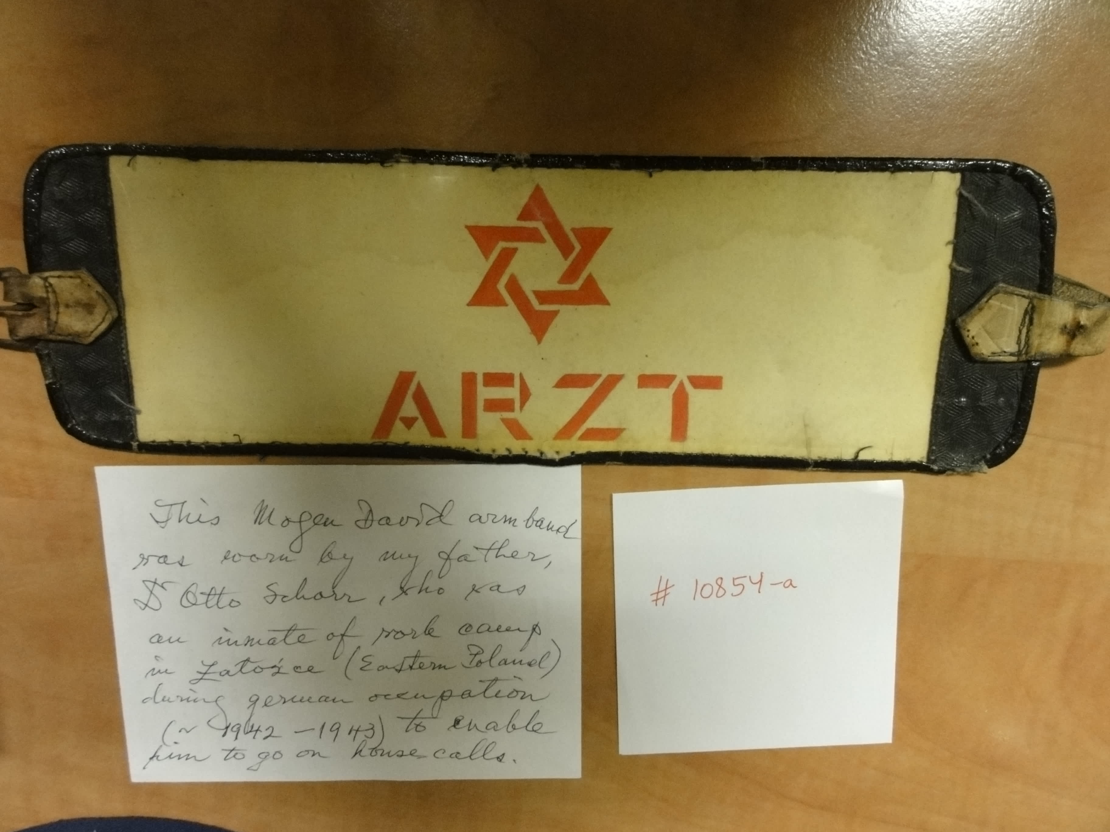 Armband with the word  physician , worn by Dr. Otto Schorr during the Holocaust, donated by his daughter, Sophie Schorr Reiner