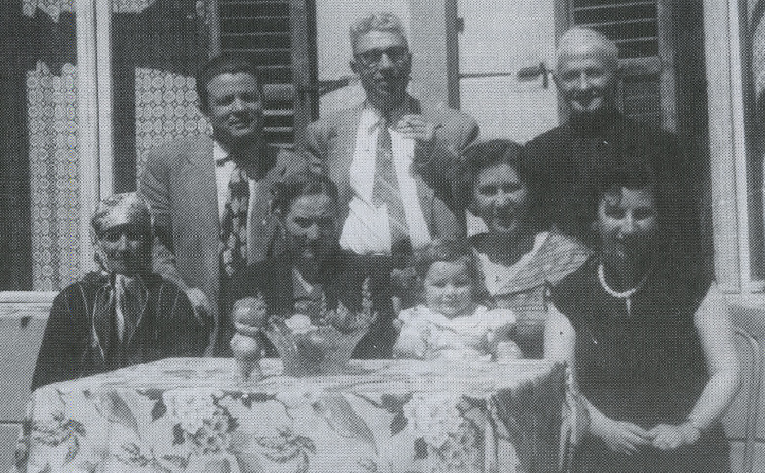 Standing from right to left: Arslan Rezniqi, Dr. Chaim Abravanel and Mustafa Rezniqi son of Arslan; sitting from right to left: Dr. Reni Levi - Abravanel, Berta Abravanel, wife of Arslan Rezniqi, unknown woman and baby Rahel Levi