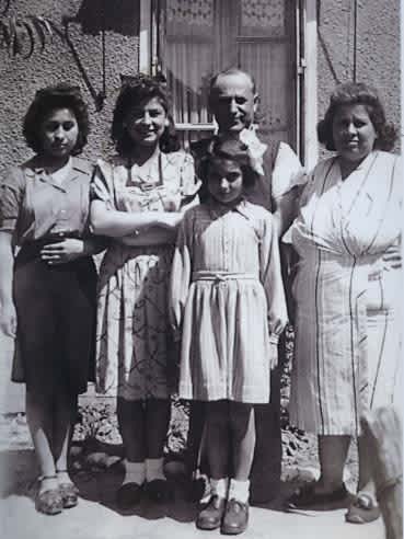 Left to right: Lisa Pelta, Edith Pelta, Hersch Pelta, Gerda Pelta.  Front: Andree Langlais - spring 1944