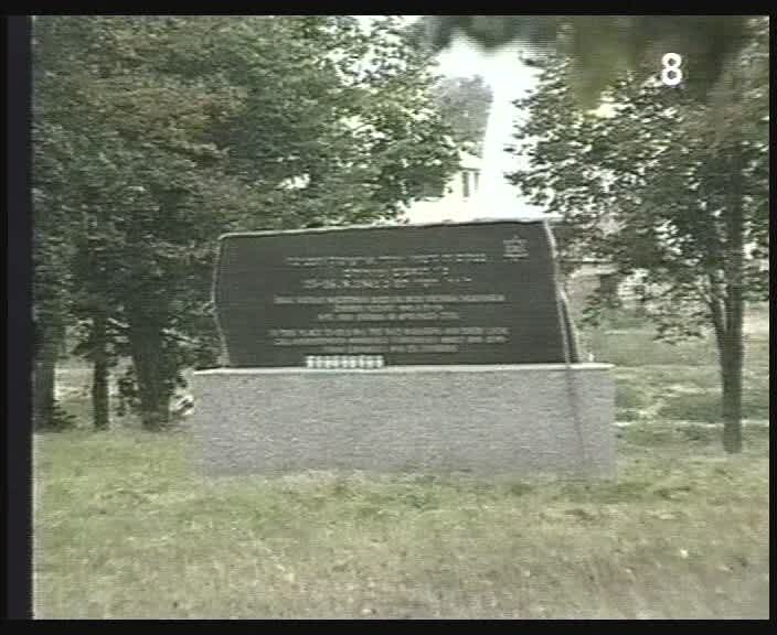 New Monument at the grave of Jewish men at the Jewish cemetery murder site. Screenshot from the film "There Once Was a Town," Yad Vashem, The Visual Center V 1725