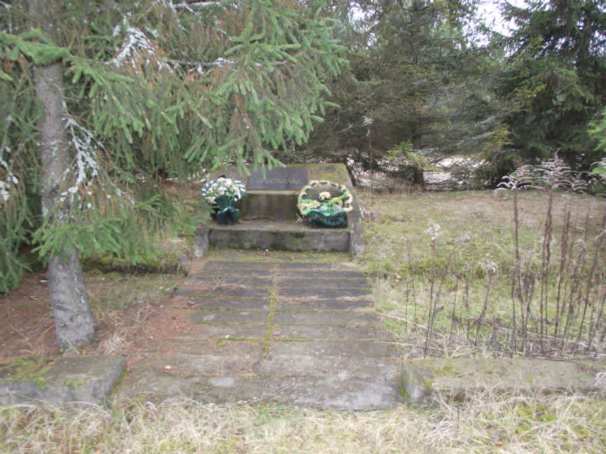 Commemorative sign at the murder site of Krymno's ghetto inmates