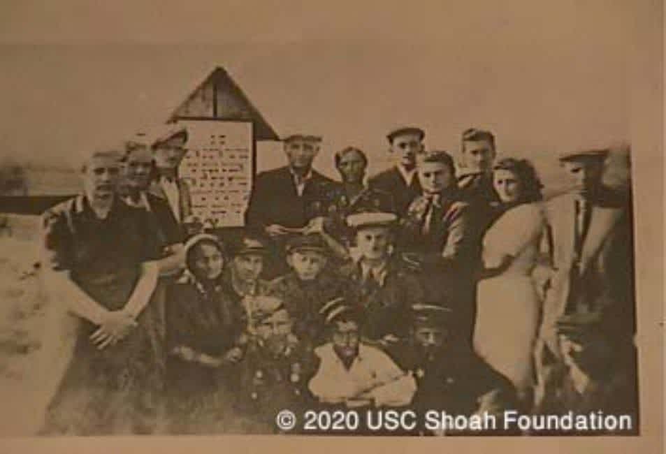 A memorial gathering near the monuments. A photograph from the interview with Edith Cimmer, USC Shoa Foundation Institute, copy YVA O.93/25381